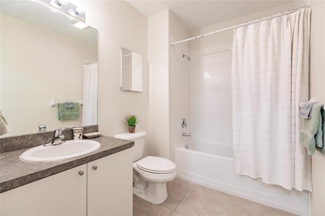 full bathroom featuring tile floors, shower / tub combo, toilet, and vanity with extensive cabinet space