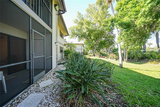 view of yard with a sunroom