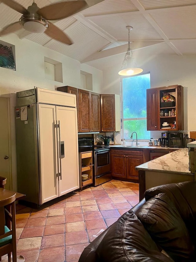 kitchen with decorative light fixtures, sink, electric range, ceiling fan, and paneled fridge