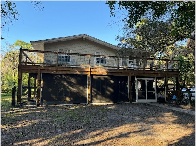 back of property featuring a sunroom