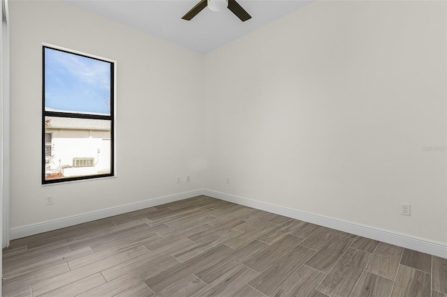 empty room with light hardwood / wood-style flooring and ceiling fan