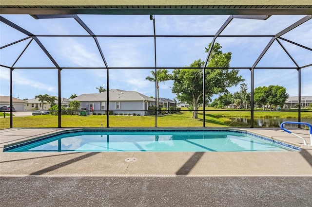 view of swimming pool featuring a yard and a lanai