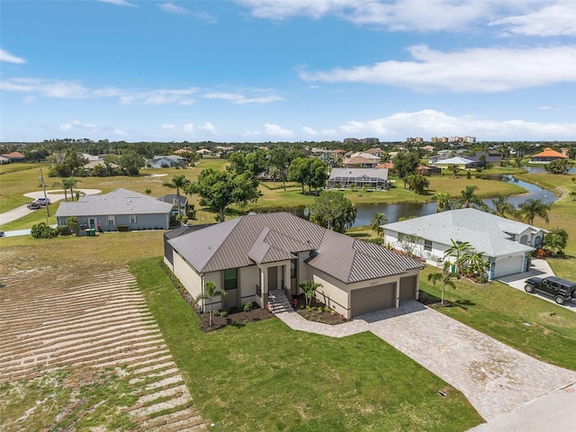 birds eye view of property featuring a water view