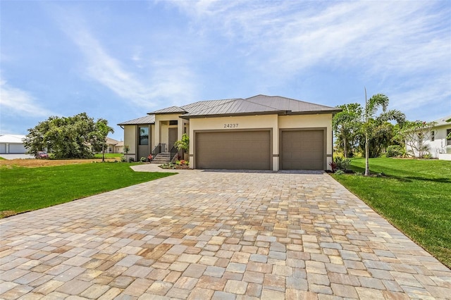 view of front facade featuring a front yard and a garage