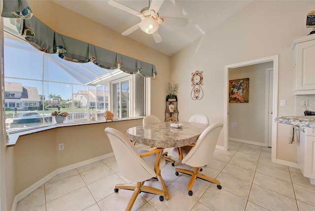 dining room featuring ceiling fan and light tile patterned floors