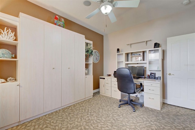 carpeted home office with ceiling fan