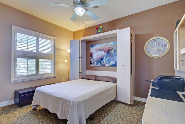 bedroom featuring light colored carpet and ceiling fan