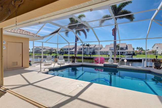 view of swimming pool featuring a lanai, a water view, and a patio