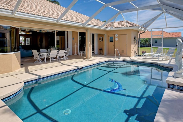 view of swimming pool with a patio and glass enclosure