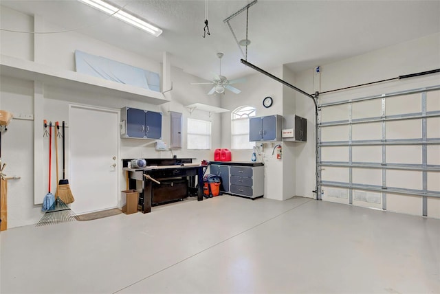 garage with electric panel and ceiling fan