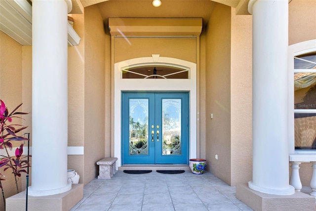 entrance to property featuring french doors