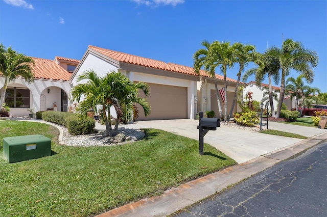 mediterranean / spanish-style house with a front lawn and a garage