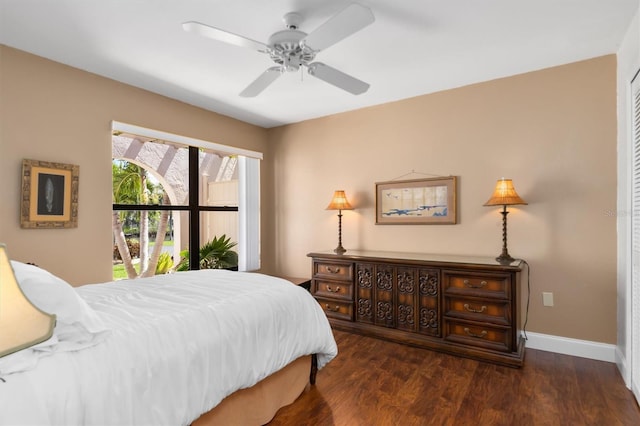 bedroom with ceiling fan and dark hardwood / wood-style flooring