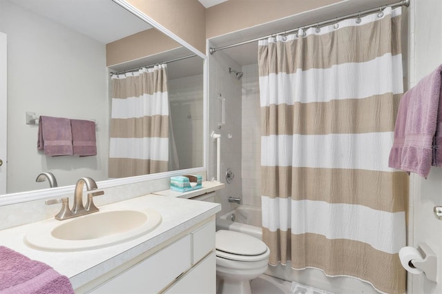 full bathroom with shower / bath combination with curtain, large vanity, and toilet