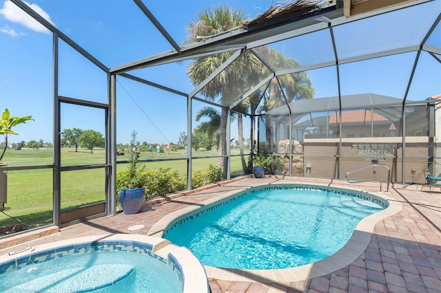 view of pool with a patio, an in ground hot tub, and glass enclosure