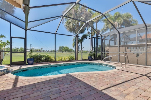 view of swimming pool featuring a lanai and a patio