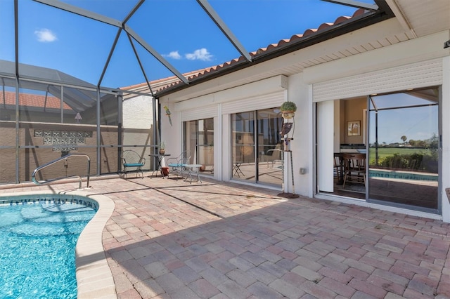 view of patio with glass enclosure