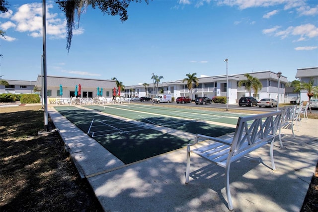 surrounding community with shuffleboard and a residential view