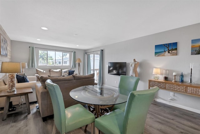 dining room featuring recessed lighting, wood finished floors, and baseboards