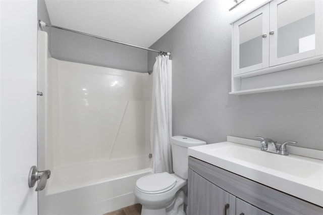 full bathroom with shower / bath combo with shower curtain, toilet, and vanity