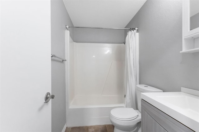 full bathroom with tile patterned flooring, toilet, vanity, and shower / tub combo with curtain