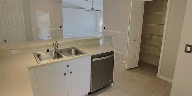 kitchen with white cabinetry, ceiling fan, light hardwood / wood-style floors, sink, and stainless steel dishwasher