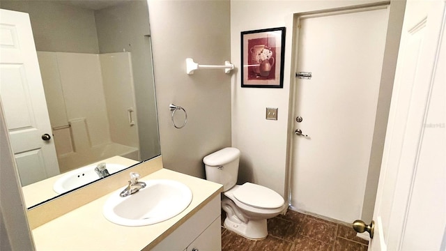 bathroom featuring vanity, tile flooring, and toilet