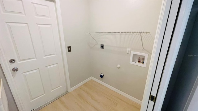 laundry area with washer hookup, hookup for a gas dryer, hookup for an electric dryer, and light hardwood / wood-style floors