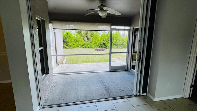 entryway featuring ceiling fan and light tile floors