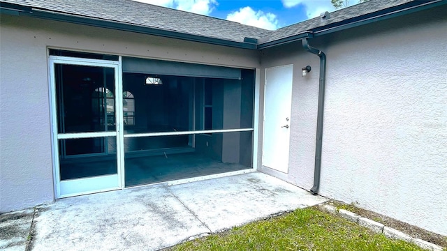 doorway to property featuring a patio area