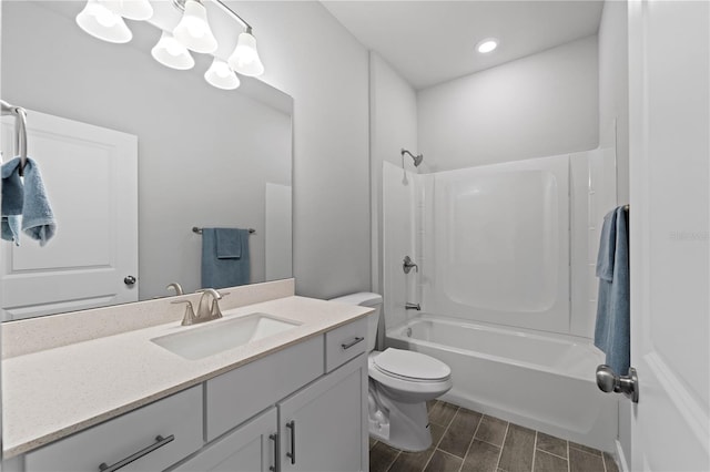 full bathroom with shower / bathing tub combination, vanity, and toilet