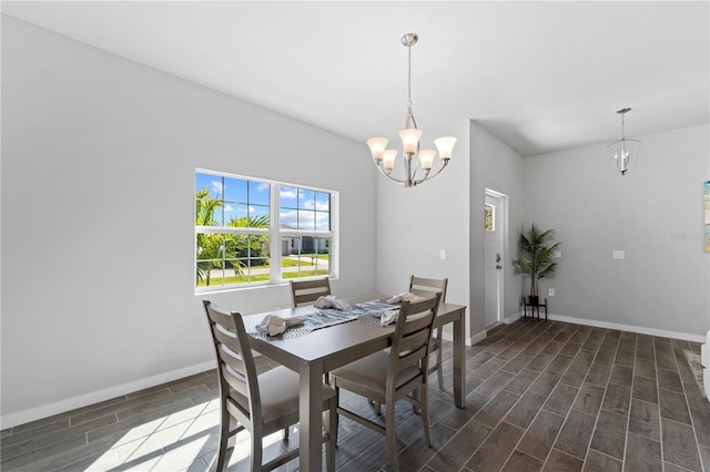 dining space featuring an inviting chandelier