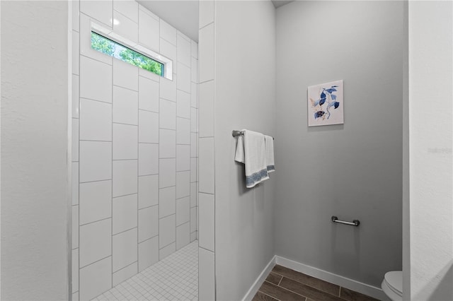 bathroom featuring toilet and walk in shower