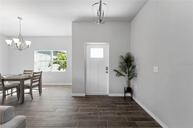 entryway with a chandelier