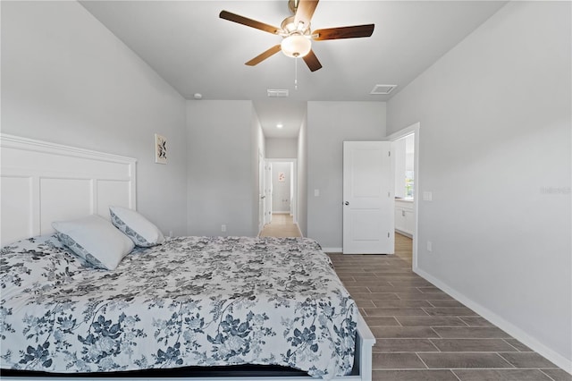 bedroom featuring ceiling fan and dark wood-type flooring