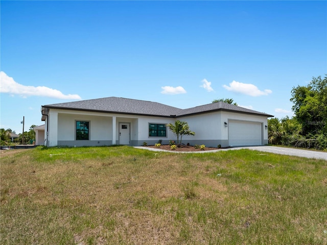 single story home with a garage and a front lawn