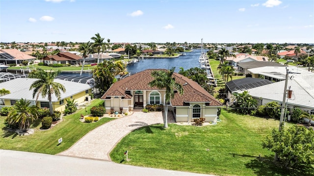 view of front facade with a water view and a front yard