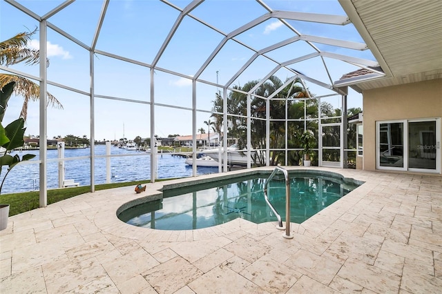 view of pool featuring a patio, a lanai, and a water view