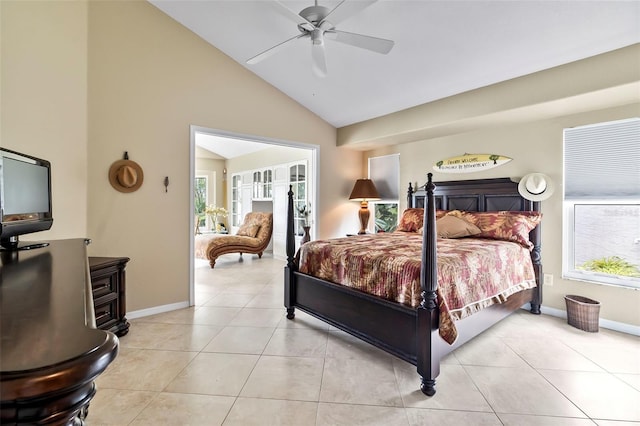 tiled bedroom with vaulted ceiling, ceiling fan, and multiple windows