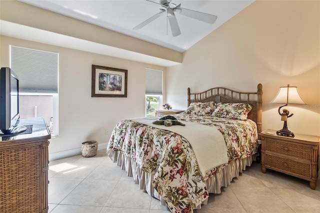 bedroom featuring vaulted ceiling, light tile flooring, and ceiling fan