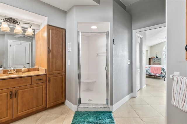 bathroom featuring a shower with door, tile flooring, and oversized vanity