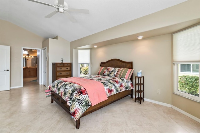 bedroom with light tile floors, connected bathroom, ceiling fan, and vaulted ceiling