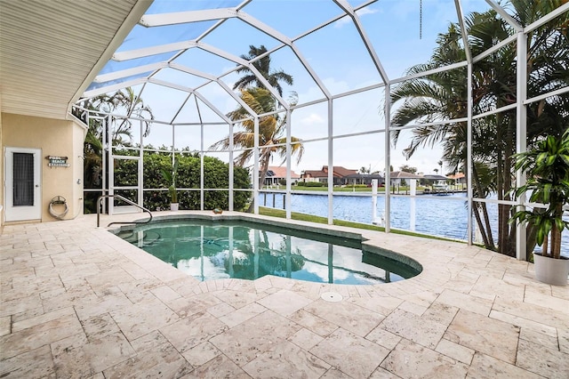 view of swimming pool featuring glass enclosure, a water view, and a patio area