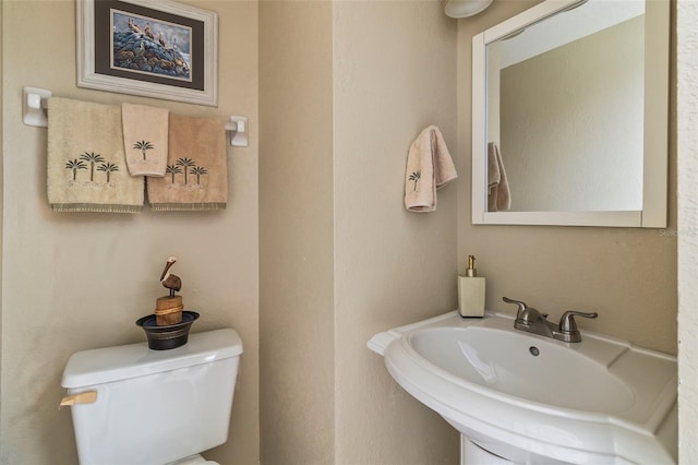 bathroom with toilet and sink