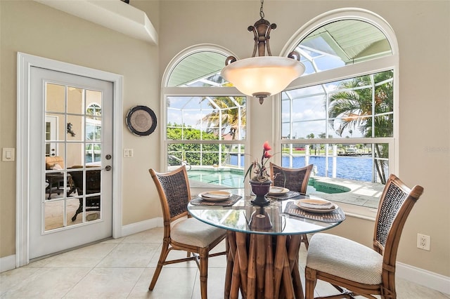 dining room with a wealth of natural light and light tile flooring