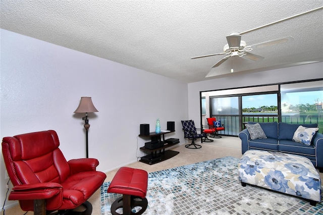 carpeted living room with a textured ceiling and ceiling fan