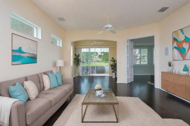 living room featuring hardwood / wood-style flooring and ceiling fan