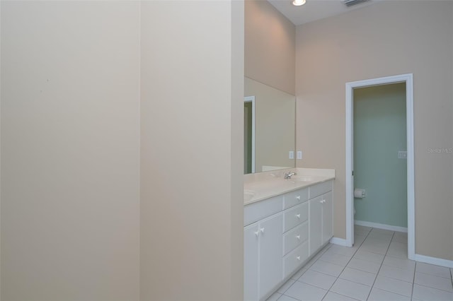 bathroom with tile patterned floors and vanity