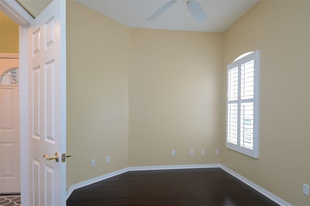 spare room featuring hardwood / wood-style flooring and ceiling fan