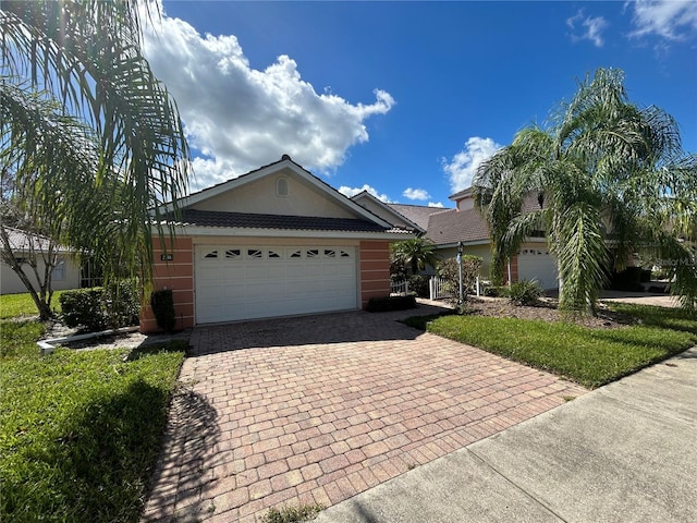 single story home featuring a garage